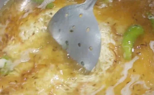 Combining Rice with Onion Mixture